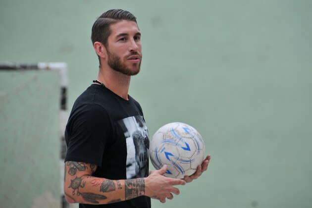 UNICEF ambassador Sergio Ramos, of Spain's national soccer team and Real Madrid holds a soccer ball during an exhibition match in Havana, Cuba, Monday, June 16, 2015.  (AP Photo/Ladyrene Perez, Cubadebate)