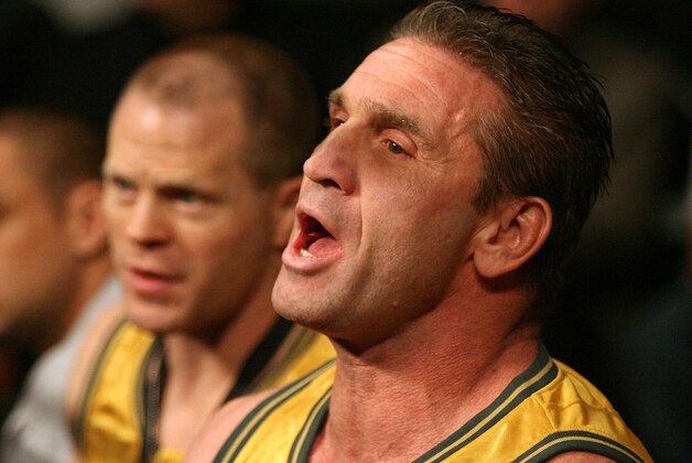 HOFFMAN ESTATES, IL - NOVEMBER 03:  Coach, Ken Shamrock yells support to his fighter Roy Nelson (Black Trunks) of the Lions against Bryan Vetell (Red Trunks) of the Pitbulls against Roy Nelson (Black Trunks) of the Lions during their Heavyweight (265 lb.) bout at the World Grand Prix Semi-Finals at the Sears Centre November 3, 2007 in Hoffman Estates, Illinois.  (Photo by Ross Dettman/Getty Images for IFL)