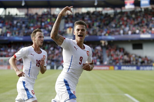 Czech Republic's Jan Kliment, center celebrates after scoring a goal during the Euro U21 soccer championship group A match between Serbia and Czech Republic, at the Letna stadium in Prague, Czech Republic, Saturday, June 20, 2015. (AP Photo/Petr David Josek)