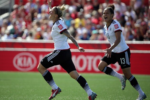 Jun 20, 2015; Ottawa, Ontario, CAN; Germany forward Anja Mittag (11) celebrates with forward Celia Sasic (13) after scoring against Sweden during the first half in the round of sixteen in the FIFA 2015 women's World Cup soccer tournament at Lansdowne Stadium. Mandatory Credit: Matt Kryger-USA TODAY Sports
