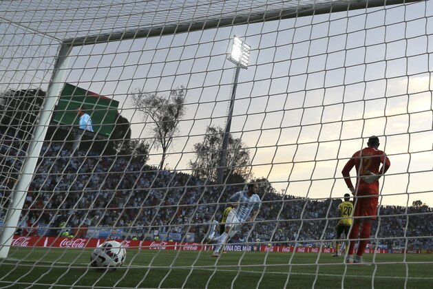 Argentina's Gonzalo Higuain , center, celebrates after scoring his team's first goal during a Copa America Group B soccer match against Jamaica at the Sausalito Stadium in Vina del Mar, Chile, Saturday, June 20, 2015. (AP Photo/Natacha Pisarenko)