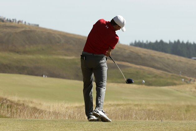 Jordan Spieth hits his tee shot on the eighth hole during the third round of the U.S. Open golf tournament at Chambers Bay on Saturday, June 20, 2015 in University Place, Wash. (AP Photo/Charlie Riedel)