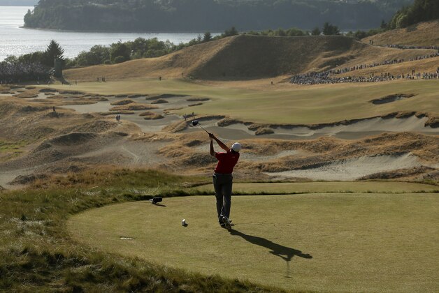 Jordan Spieth watches his tee shot on the 14th hole during the third round of the U.S. Open golf tournament at Chambers Bay on Saturday, June 20, 2015 in University Place, Wash. (AP Photo/Charlie Riedel)
