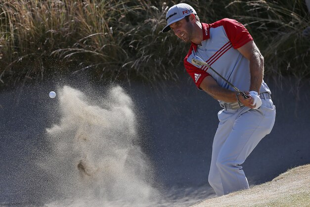 Dustin Johnson hits out of the bunker on the 10th hole during the third round of the U.S. Open golf tournament at Chambers Bay on Saturday, June 20, 2015 in University Place, Wash. (AP Photo/Matt York)