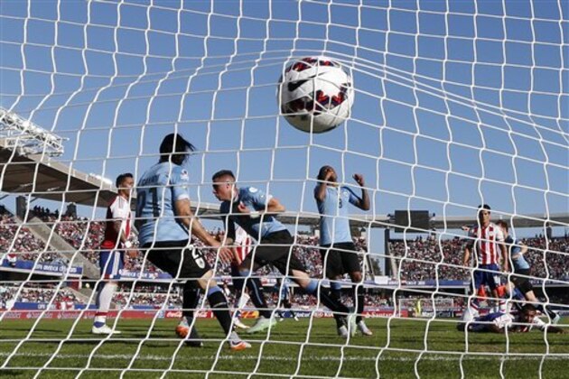 Uruguay's Jose Maria Gimenez, center left, celebrates after scoring the opening goal during a Copa America Group B soccer match against Paraguay at La Portada stadium in La Serena, Chile, Saturday, June 20, 2015. (AP Photo/Andre Penner)