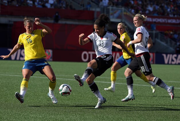 Jun 20, 2015; Ottawa, Ontario, CAN; Germany forward Celia Sasic (13) controls the ball against Sweden defender Lina Nilsson (16) during the second half in the round of sixteen in the FIFA 2015 women's World Cup soccer tournament at Lansdowne Stadium. Mandatory Credit: Matt Kryger-USA TODAY Sports