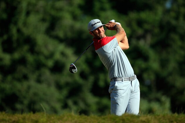 UNIVERSITY PLACE, WA - JUNE 20:  Dustin Johnson of the United States hits his tee shot on the 14th hole during the third round of the 115th U.S. Open Championship at Chambers Bay on June 20, 2015 in University Place, Washington.  (Photo by David Cannon/Getty Images)