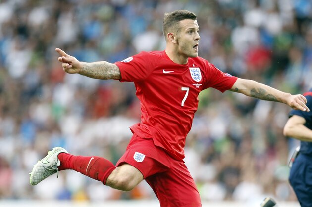England's Jack Wilshere shoots to score during the Euro 2016 Group E qualifying soccer match between Slovenia and England, in Ljubljana, Slovenia, Sunday, June 14, 2015. (AP Photo/Darko Bandic)