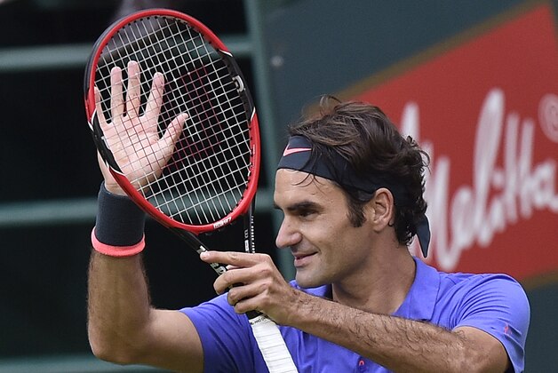 Roger Federer of Switzerland reacts to supporters after winning the quarterfinal match against Florian Mayer of Germany at the Gerry Weber Open ATP tennis tournament in Halle, Germany, Friday, June 19, 2015. (AP Photo/Martin Meissner)