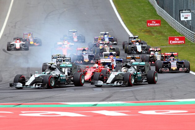 SPIELBERG, AUSTRIA - JUNE 21:  Nico Rosberg of Germany and Mercedes GP leads Lewis Hamilton of Great Britain and Mercedes GP and Sebastian Vettel of Germany and Ferrari into the first corner during the Formula One Grand Prix of Austria at Red Bull Ring on June 21, 2015 in Spielberg, Austria.  (Photo by Mark Thompson/Getty Images)