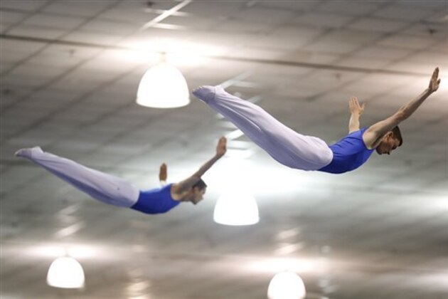 Steven Gluckstein, right, and Logan Dooley compete in the synchro trampoline event at the USA Gymnastics Championships in San Jose, Calif., Wednesday, June 27, 2012. The two placed second. (AP Photo/Jae C. Hong)