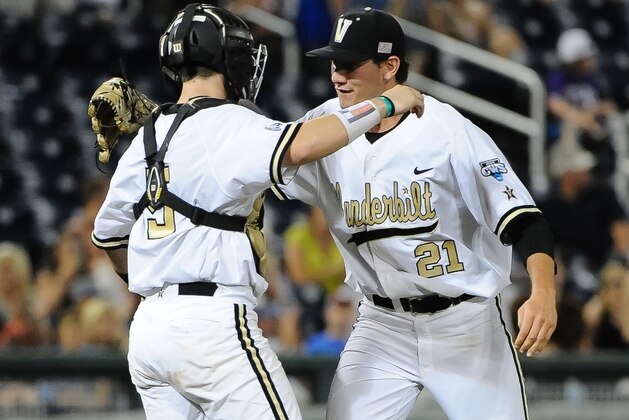 Jun 19, 2015; Omaha, NE, USA; Vanderbilt Commodores pitcher John Kilichowski (21) and catcher Jason Delay (5) celebrate after the win against the TCU Horned Frogs in the 2015 College World Series at TD Ameritrade Park. Vanderbilt defeated TCU 7-1. Mandatory Credit: Steven Branscombe-USA TODAY Sports