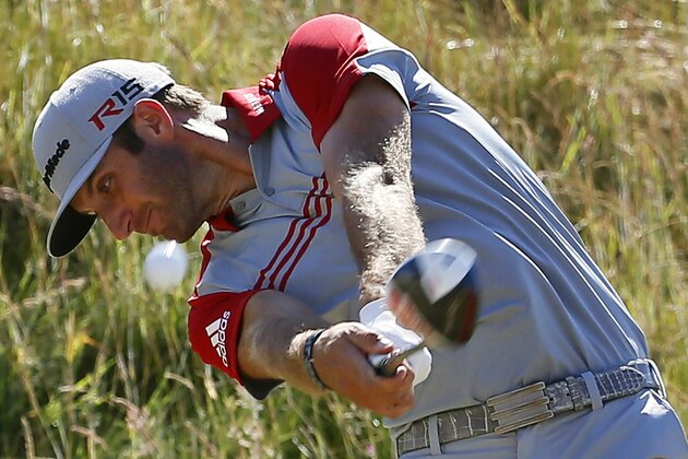 Dustin Johnson hits his tee shot on the seventh hole during the third round of the U.S. Open golf tournament at Chambers Bay on Saturday, June 20, 2015 in University Place, Wash. (AP Photo/Matt York)