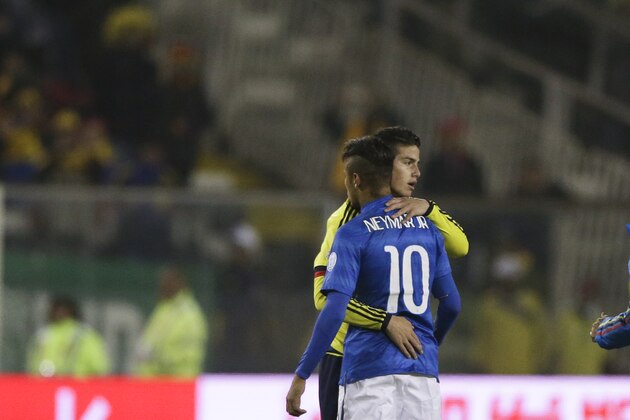 Colombia's James Rodriguez embraces Brazil's Neymar. back to camera, after their Copa America Group C soccer match at the Monumental stadium in Santiago, Chile, Wednesday, June 17, 2015. (AP Photo/Ricardo Mazalan)