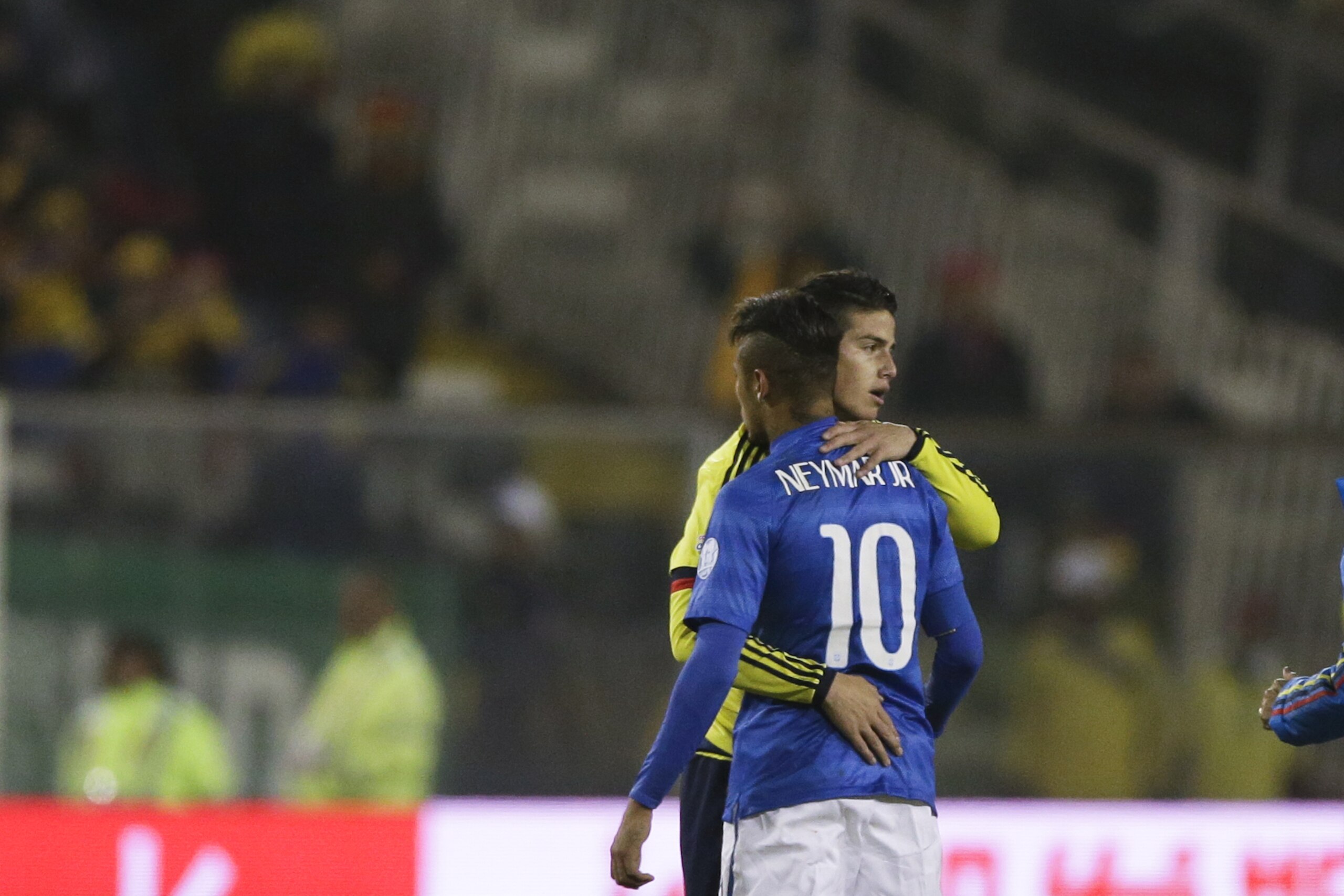 Colombia's James Rodriguez embraces Brazil's Neymar. back to camera, after their Copa America Group C soccer match at the Monumental stadium in Santiago, Chile, Wednesday, June 17, 2015. (AP Photo/Ricardo Mazalan)