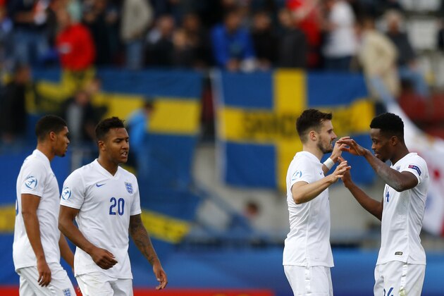 England's players celebrate victory after the Euro U21 soccer championship group B match between Sweden and England, at the Ander stadium in Olomouc, Czech Republic, Sunday, June 21, 2015. (AP Photo/Matthias Schrader)