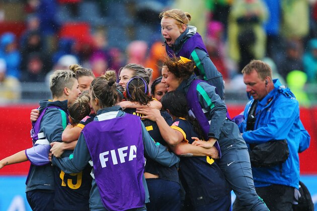 MONCTON, NB - JUNE 21:  Australia players celebrate victory after the FIFA Women's World Cup 2015 round of 16 match between Brazil and Australia at Moncton Stadium on June 21, 2015 in Moncton, Canada. Australia reach the quarter finals with a 1-0 win.  (Photo by Elsa/Getty Images)
