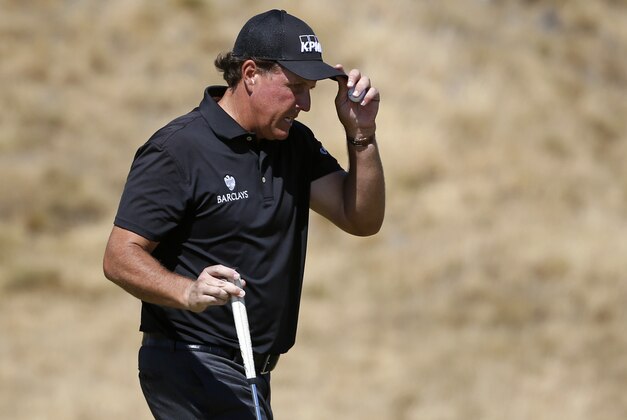 Phil Mickelson walks off the 15th green during the second round of the U.S. Open golf tournament at Chambers Bay on Friday, June 19, 2015 in University Place, Wash. (AP Photo/Lenny Ignelzi)