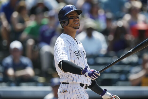 Colorado Rockies right fielder Carlos Gonzalez bats against the Milwaukee Brewers in the fourth inning of a baseball game Saturday, June 20, 2015, in Denver. (AP Photo/David Zalubowski)