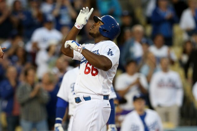 LOS ANGELES, CA - JUNE 10:  Yasiel Puig #66 of the Los Angeles Dodgers celebrates as he scores on his three run home run in the second inning against the Arizona Diamondbacks at Dodger Stadium on June 10, 2015 in Los Angeles, California.  (Photo by Stephen Dunn/Getty Images)
