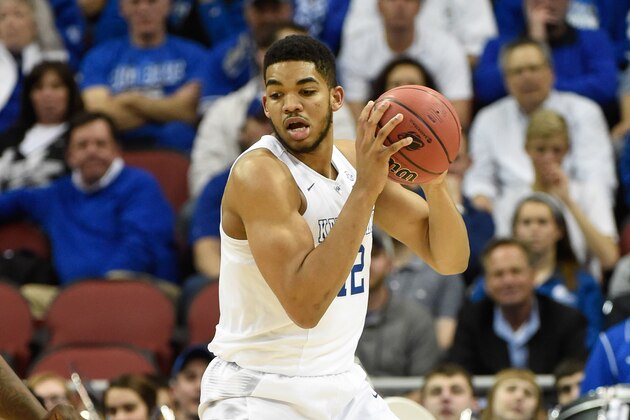 Mar 19, 2015; Louisville, KY, USA; Kentucky Wildcats forward Karl-Anthony Towns (12) posts up against the Hampton Pirates during the second half in the second round of the 2015 NCAA Tournament at KFC Yum! Center. Kentucky wins 79-56. Mandatory Credit: Jamie Rhodes-USA TODAY Sports