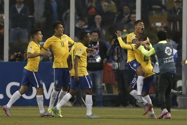 Brazil's Thiago Silva celebrates with team mates after scoring his team's first goal during a Copa America Group C soccer match at the Monumental stadium in Santiago, Chile, Sunday, June 21, 2015. Brazil won the match 2-1.(AP Photo/Silvia Izquierdo)