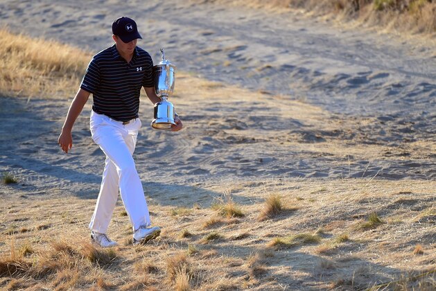 UNIVERSITY PLACE, WA - JUNE 21: Jordan Spieth of the United States walks with the trophy after winning the 115th U.S. Open Championship at Chambers Bay on June 21, 2015 in University Place, Washington. (Photo by Harry How/Getty Images) UNIVERSITY PLACE, WA - JUNE 21: Jordan Spieth of the United States walks with the trophy after winning the 115th U.S. Open Championship at Chambers Bay on June 21, 2015 in University Place, Washington. (Photo by Harry How/Getty Images)