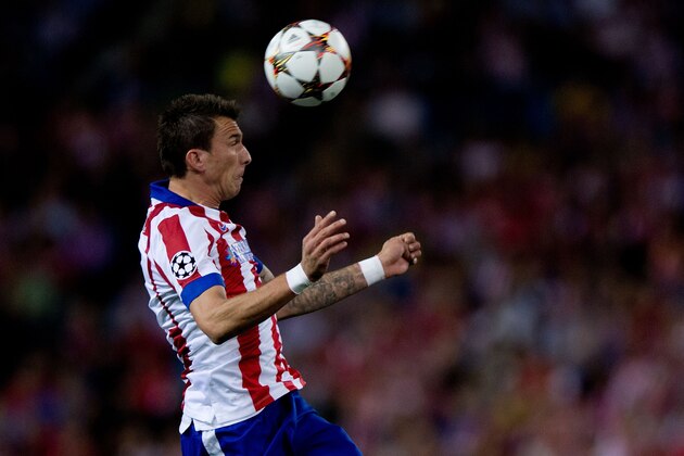 MADRID, SPAIN - OCTOBER 22: Mario Mandzukic of Atletico de Madrid saves on a header during the UEFA Champions League group A match between Club Atletico de Madrid and Malmo FF at Vicente Calderon stadium on October 22, 2014 in Madrid, Spain. (Photo by Gonzalo Arroyo Moreno/Getty Images) MADRID, SPAIN - OCTOBER 22: Mario Mandzukic of Atletico de Madrid saves on a header during the UEFA Champions League group A match between Club Atletico de Madrid and Malmo FF at Vicente Calderon stadium on October 22, 2014 in Madrid, Spain. (Photo by Gonzalo Arroyo Moreno/Getty Images)