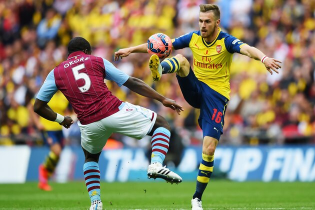 LONDON, ENGLAND - MAY 30:  Aaron Ramsey of Arsenal controls the ball from Jores Okore of Aston Villa during the FA Cup Final between Aston Villa and Arsenal at Wembley Stadium on May 30, 2015 in London, England.  (Photo by Shaun Botterill/Getty Images)