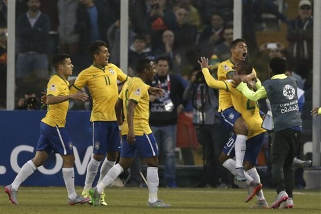 Brazil's Thiago Silva celebrates with team mates after scoring his team's first goal during a Copa America Group C soccer match at the Monumental stadium in Santiago, Chile, Sunday, June 21, 2015. Brazil won the match 2-1.(AP Photo/Silvia Izquierdo)