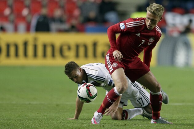 Denmark’s Viktor Fischer, foreground and Germany’s Joshua Kimmich challenge for the ball during the Euro U21 soccer championship group A match between Germany and Denmark, at the Eden stadium stadium in Prague, Czech Republic, Saturday, June 20, 2015. (AP Photo/Petr David Josek)