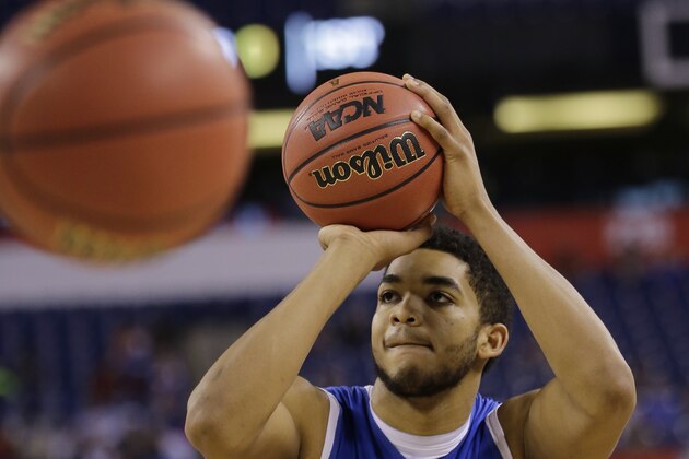 Kentucky's Karl-Anthony Towns shoots during a practice session for the NCAA Final Four tournament college basketball semifinal game Friday, April 3, 2015, in Indianapolis. Kentucky plays Wisconsin on Saturday. (AP Photo/David J. Phillip)