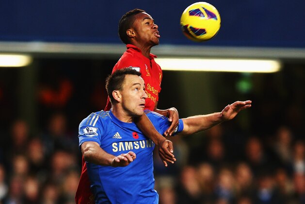LONDON, ENGLAND - NOVEMBER 11:  John Terry (26) of Chelsea and Raheem Sterling of Liverpool challenge for the ball during the Barclays Premier League match between Chelsea and Liverpool at Stamford Bridge on November 11, 2012 in London, England.  (Photo by Clive Rose/Getty Images)