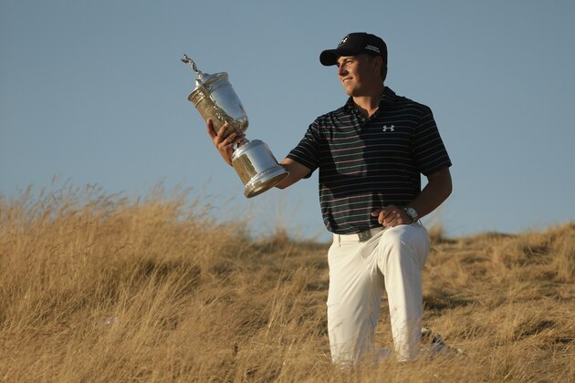 Jordan Spieth poses with the trophy after winning the U.S. Open golf tournament at Chambers Bay on Sunday, June 21, 2015 in University Place, Wash. (AP Photo/Charlie Riedel)