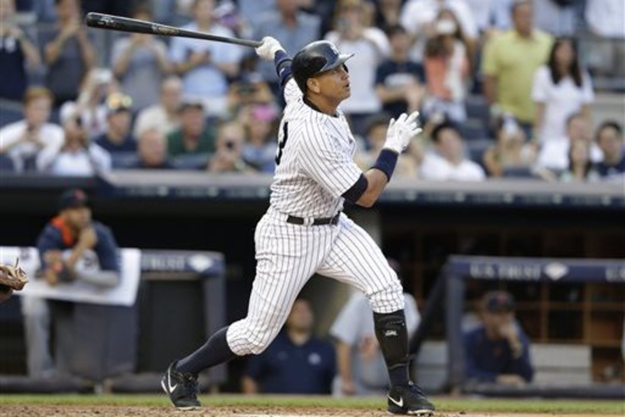 New York Yankees' Alex Rodriguez hits a home run for his 3,000th career hit, during the first inning of a baseball game against the Detroit Tigers Friday, June 19, 2015, in New York. (AP Photo/Frank Franklin II)