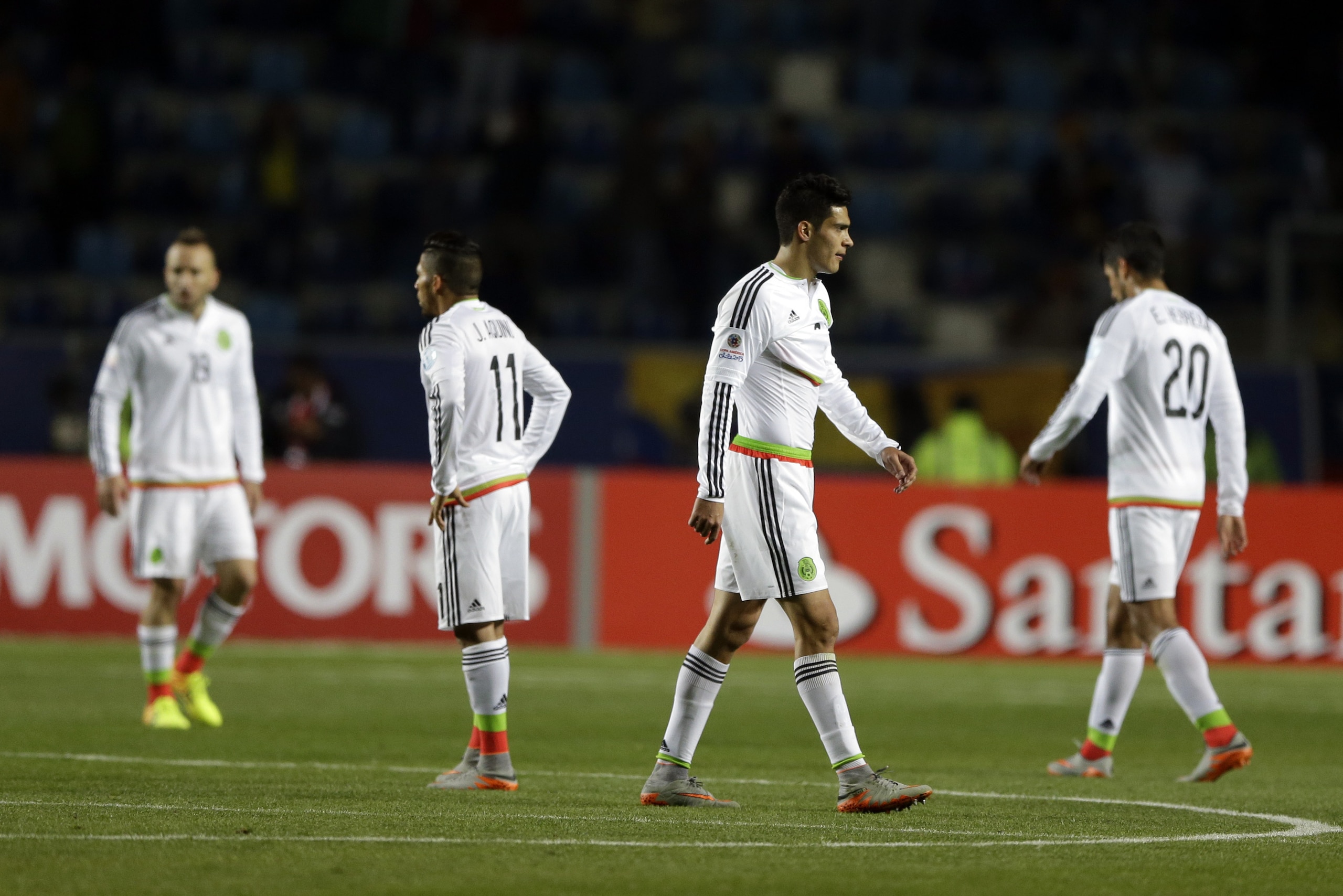 Mexico's players leave the pitch after their  Copa America Group A match against Ecuardor at El Teniente Stadium in Rancagua, Chile, Friday, June 19, 2015. Ecuador won the match 2-1.(AP Photo/Ricardo Mazalan)