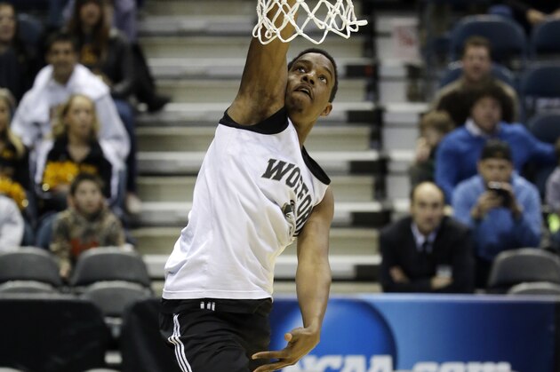 Wofford guard Jeremiah Tate dunks during a practice session for their NCAA college basketball tournament game Wednesday, March 19, 2014, in Milwaukee. Wofford plays Michigan on Thursday, March 20, 2014. (AP Photo/Morry Gash)