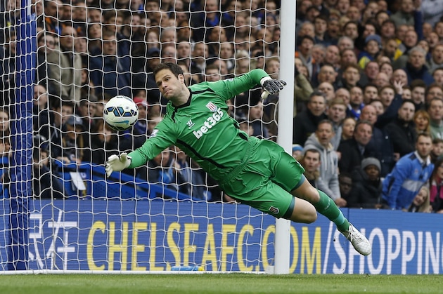 Stoke's Asmir Begovic makes a save during the English Premier League soccer match between Chelsea and Stoke City at Stamford Bridge stadium in London, Saturday, April 4, 2015. (AP Photo/Kirsty Wigglesworth)
