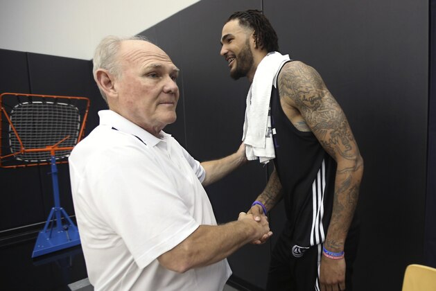 Kentucky center Willie Cauley-Stein, right, shakes hands with Sacramento Kings coach George Karl, after a workout with the Kings in Sacramento, Calif., Thursday, June 11, 2015. The Kings have the sixth position in the NBA basketbal draft and the 7-foot-2 Cauley-Stein is expected to be one of the top picks in the draft. (AP Photo/Rich Pedroncelli)