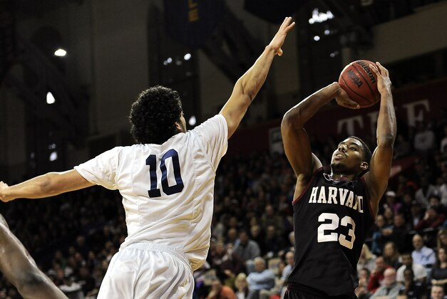 Harvard's Wesley Saunders (23) is seen during an NCAA college basketball game in the Ivy League championship playoff against Yale on Saturday, March 14, 2015, in Philadelphia. Harvard beat Yale 53-51. (AP Photo/Michael Perez)