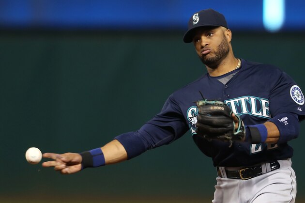 Seattle Mariners' Robinson Cano throws out Cleveland Indians' Mike Aviles at first base during the seventh inning of a baseball game, Tuesday, June 9, 2015, in Cleveland. (AP Photo/Ron Schwane)