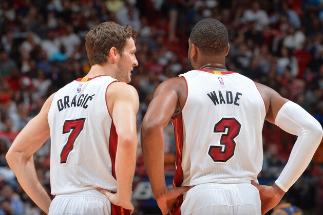 Miami,FL - MARCH 16:  Goran Dragic #7 and Dwyane Wade #3 of the Miami Heat look on against the Cleveland Cavaliers at the American Airlines Arena on March 16, 2015 in Miami,Florida.NOTE TO USER: User expressly acknowledges and agrees that, by downloading and or using this photograph, User is consenting to the terms and conditions of the Getty Images License Agreement. Mandatory Copyright Notice: Copyright 2015 Photo by Jesse D. Garrabrant/NBAE via Getty Images)