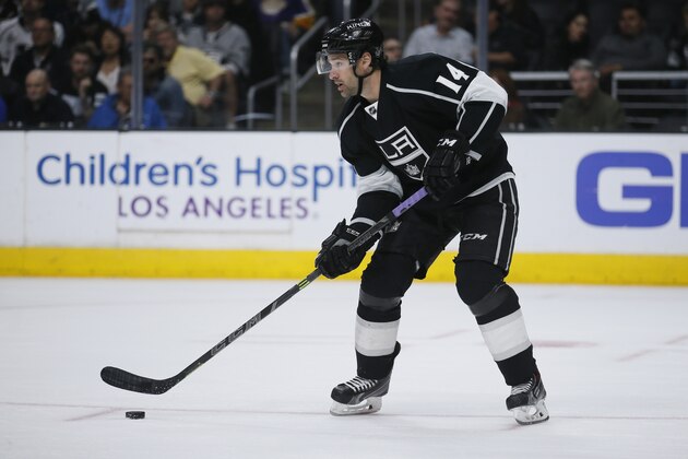 Los Angeles Kings right wing Justin Williams skates with the puck against the Arizona Coyotes during the third period of an NHL hockey game, Monday, March 16, 2015, in Los Angeles. (AP Photo/Danny Moloshok)