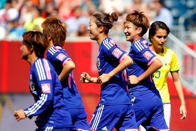 WINNIPEG, MB - JUNE 16:  Yuki Ogimi #17 of Japan celebrates her goal against Ecuador with Yuika Sugasawa #15 during the FIFA Women's World Cup Canada 2015 Group C match between Ecuador and Japan at Winnipeg Stadium on June 16, 2015 in Winnipeg, Canada.  (Photo by Kevin C. Cox/Getty Images)