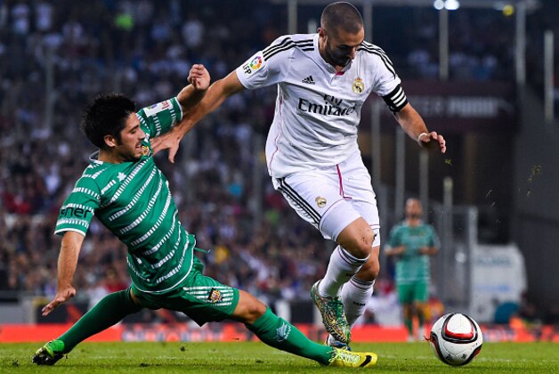 BARCELONA, SPAIN - OCTOBER 29:  Karim Benzema of Real Madrid CF competes for the ball with Joel of Cornella during the Copa Del Rey Round of 32 first leg match at Power8 Stadium on October 29, 2014 in Barcelona, Spain.  (Photo by David Ramos/Getty Images)