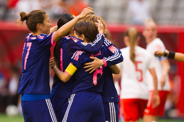 VANCOUVER, BC - MAY 8: Aya Miyama #8 of Japan is congratulated by teammates Yuki Ogimi #17 and Mizuho Sakaguchi #6 after scoring on a penalty shot against Switzerland during the FIFA Women's World Cup Canada 2015 Group C match between Japan and Switzerland June, 8, 2015 at BC Place Stadium in Vancouver, British Columbia, Canada.  (Photo by Rich Lam/Getty Images)