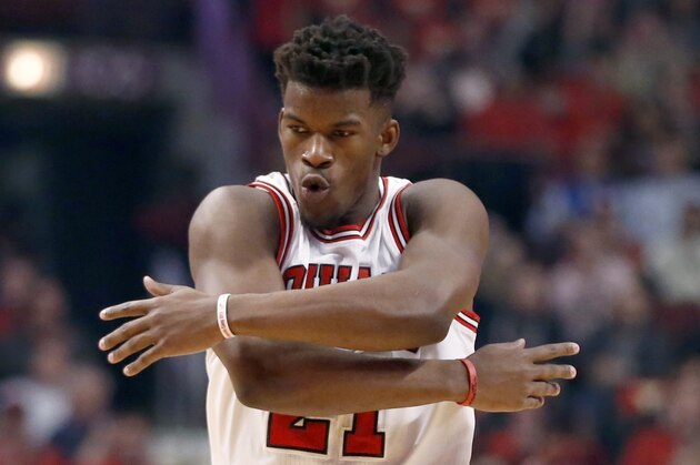 Chicago Bulls guard Jimmy Butler (21) reacts after making a three-point shot during the first half in Game 5 of the NBA basketball playoffs against the Milwaukee Bucks Monday, April 27, 2015, in Chicago. (AP Photo/Charles Rex Arbogast)