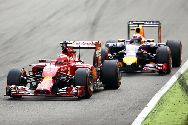 MONZA, ITALY - SEPTEMBER 07:  Kimi Raikkonen of Finland and Ferrari and Daniel Ricciardo of Australia and Infiniti Red Bull Racing drive during the F1 Grand Prix of Italy at Autodromo di Monza on September 7, 2014 in Monza, Italy.  (Photo by Bryn Lennon/Getty Images)
