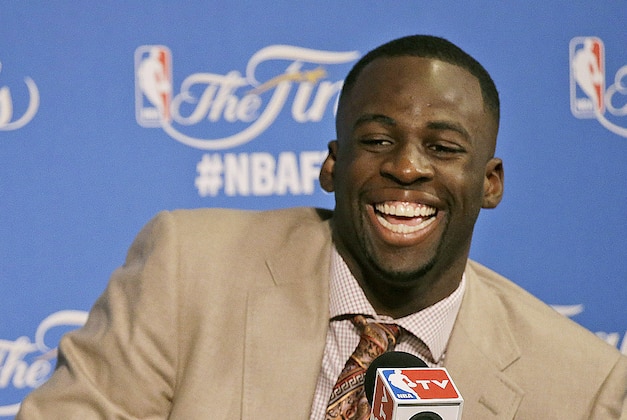 Golden State Warriors guard Stephen Curry, left, speaks next to forward Draymond Green after Game 5 of basketball's NBA Finals against the Cleveland Cavaliers in Oakland, Calif., Sunday, June 14, 2015. The Warriors won 104-91. (AP Photo/Ben Margot)