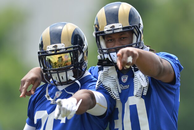 St. Louis Rams running backs Todd Gurley (30) and Benny Cunningham (36) during an NFL football organized team activity, Thursday, June 11, 2015, in St. Louis. (AP Photo/Michael Thomas)